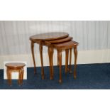 A Nest Of Tables Three oval form tables, each raised on cabriole legs,