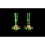 A Pair Of Continental Glass Bud Vases Specimen form vases in emerald green glass,