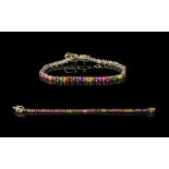 Multi Colours of Sapphire Tennis Bracelet, a continuous row of oval cut green, yellow, orange,