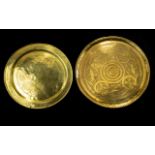 A Pair Of Middle Eastern Brass Chargers Circular form with etched patterning of traditional design,