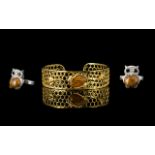 Two Natural Honey Jasper Set Items comprising a honeycomb and bee cuff bangle and an owl ring;