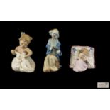Nao by Lladro Porcelain Figures ( 2 ) + 1 Other. Comprises 1/ Young Clown Figure - Seated.