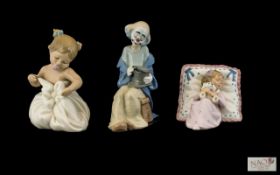 Nao by Lladro Porcelain Figures ( 2 ) + 1 Other. Comprises 1/ Young Clown Figure - Seated.