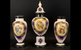 A Victorian Opaline Glass Three Piece Garniture Set Each with Handpainted enamels with central