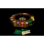 Gaming Interest Italian Table Top Roulette Wheel Finished in faux wood grain with apertures for