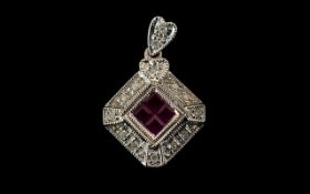 9ct White Gold Ruby And Diamond Set Designer Style Pendant Set with four calibre cut rubies