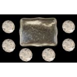 A Large Unmarked Silver Tray Of shaped rectangular form engraved throughout in the aesthetic style,