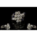 18ct White Gold Attractive Diamond And Sapphire Set Cluster Ring flower head design diamonds and