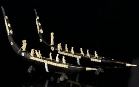 Pair of Hand Carved Model Venetian Gondolas - in horn with decals, gondolier, and passengers also