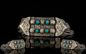 A Silver And Turquoise Set Chain Link Bracelet Bohemian style bracelet comprising articulated