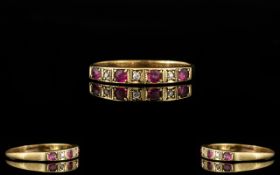 18ct Gold - 3 Stone Ruby and Diamond Dress Ring, The Four Rubies Set with Diamond Spacers.