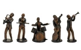 A Group Of Cast Metal Figurines In The Form Of A Jazz Band Cast spelter figures, each cold painted