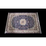 A Very Large Woven Silk Carpet Keshan rug with blue ground and traditional Middle Eastern floral