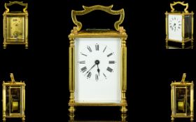 English Brass Lever Escapement Carriage Clock with glass panels. Visible escapement.