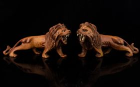 A Pair Of Antique Carved Matching Lions. Superbly Done. Both Bearing Teeth. With Glass Eyes.