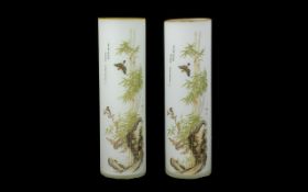 A Pair Of Oriental Glass Spill Vases Each of cylindrical form in opaque glass with printed bamboo