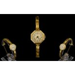 1920's Ladies 18ct Gold Octagonal Shaped Mechanical Wrist Watch with 18ct Gold Integral Bracelet.