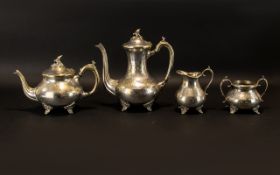 A Four Piece Anglo Indian Style Plated Metal Tea And Coffee Service Comprising footed teapot,