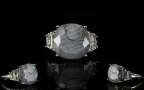 Natural Silver Sapphire and White Topaz Ring, a square cushion cut silver sapphire of 11.75cts,