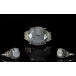 Natural Silver Sapphire and White Topaz Ring, a square cushion cut silver sapphire of 11.75cts,