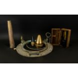 A Mixed Collection Of Military Items To include brass shell case, depth charge detonators,