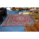 A Traditional And Very Large Afghan Wool Carpet In traditional Persian design with triple borders,