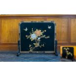 A Black Lacquered Chinoiserie Fire Screen Of traditional form with blossom and birds design with