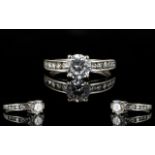 A 9ct White Gold And CZ Set Solitaire Ring Marked 9ct to shank and set with central faceted CZ,
