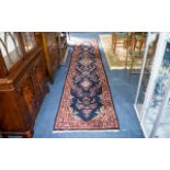 A Traditional Afghan Wool Runner In traditional Persian design with triple border and central floral