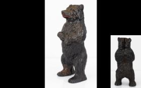 A Cast Metal Standing Bear Money Box cast in two pieces, textured finish, height, 6 1/2 inches.