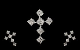 A 9ct White Gold Diamond Cross Fifty four round modern brilliant cut diamonds,