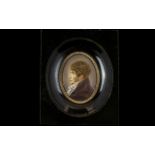 A 19th Century Portrait Miniature Housed in black lacquered frame,