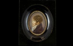 A 19th Century Portrait Miniature Housed in black lacquered frame,