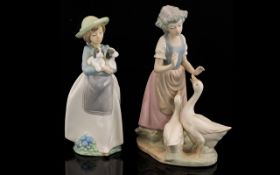 Two Figurines. One A Nao Figure "What An Armful" 1156 Figurine - Girl Holding Two Puppies/ Dogs 10.