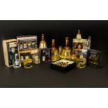 A Mixed Collection Of Whisky Gift Packs And Commemorative Bottles To include four empty collectable