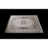 A Very Large Woven Silk Carpet Keshan rug with beige ground and traditional Middle Eastern floral