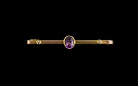 9ct Yellow Gold And Diamond Bar Brooch Stamped 9ct, the centre set with oval faceted gemstone,