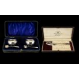 A Boxed Set Of Silver Salts Of plain form each with accompanying spoons, housed in fitted box,