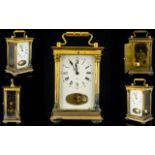 A Brass Cased Carriage Clock Comprising white enamel dial, Roman numerals with outer minutes