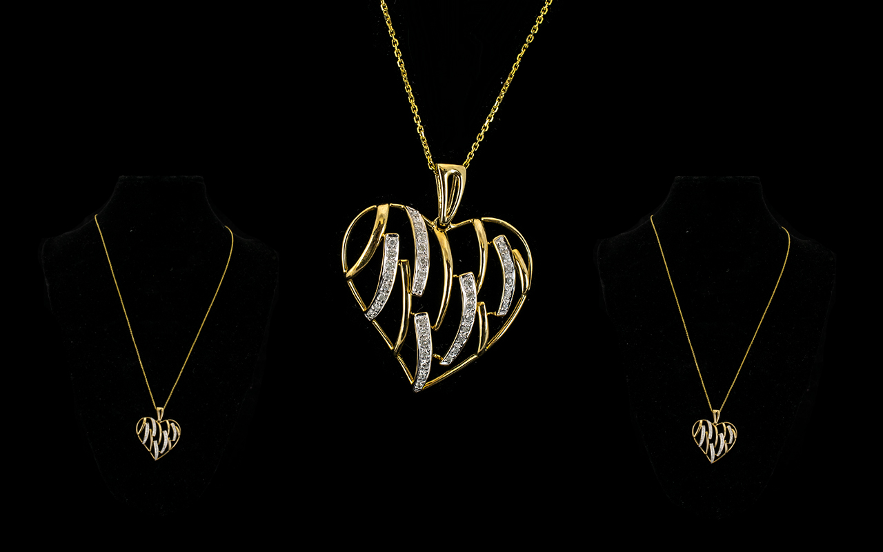 9ct Gold Heart Pendant And Chain In the form of an open heart with round brilliant cut diamond