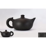 Chinese Republic Yixing Teapot Of plain form with squat body and character marks for GeTaoZhong.