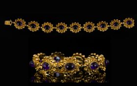 9ct Gold And Amethyst Fancy Link Bracelet Comprising bauble panel links each set with amethyst