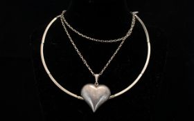 Contemporary Silver Heart Pendant Necklace Large three dimensional heart pendant on long silver