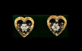 A Pair Of 9ct Gold CZ Set Stud Earrings Open heart form earrings in textured 9ct gold, the centres