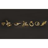 A Collection Of Seven 9ct Gold And Diamond Set Charms Each hallmarked to bale, to include bike,