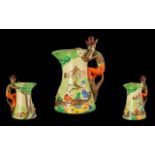 An Art Deco Jug Modelled In The Form Of The Three Little Pigs painted in primary tones throughout,