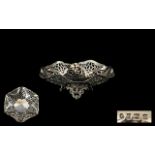 18ct White Gold And Diamond Cluster Ring Set with a central round brilliant cut diamond of approx