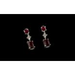 Ruby and Cambodian Zircon Drop Earrings, each earring having a cushion cut ruby, of over 1ct,