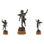 A Cast Metal Figure In The Form Of A Classical Winged Putti Bronzed metal figure raised on stepped