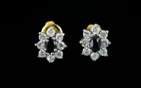 Ladies - Nice Quality Flower Head Design Earrings Dark faceted central stone, surrounded by CZ.